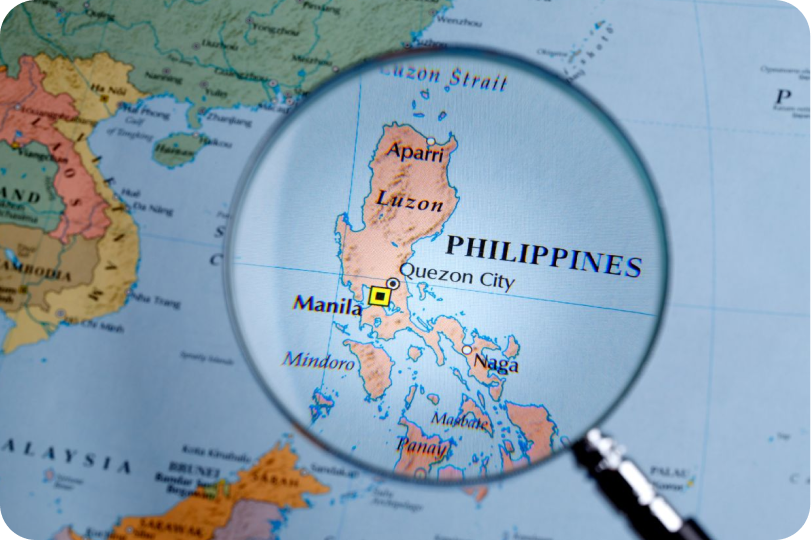 A map of the Philippines under a magnifying glass.
